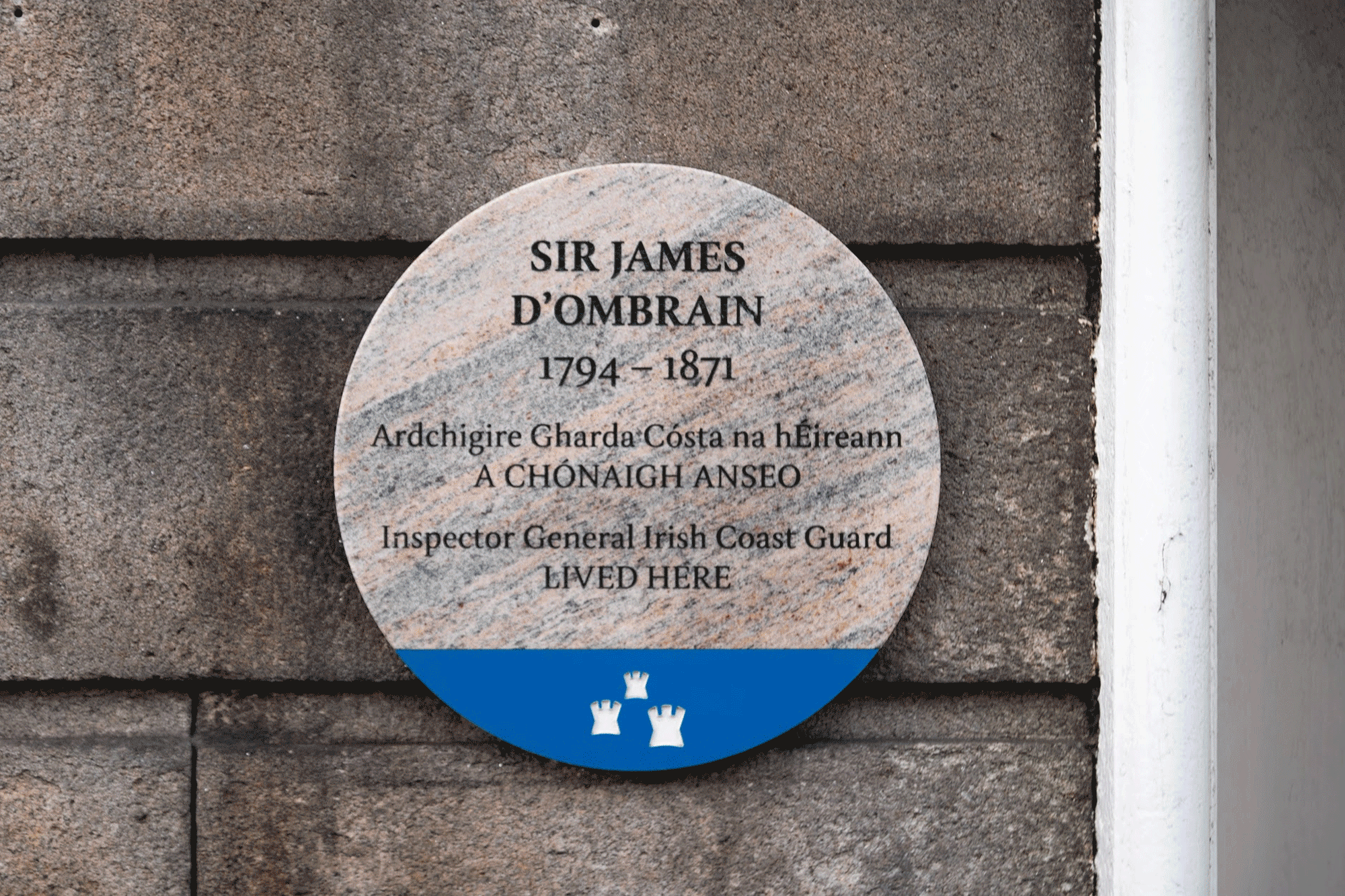A GIF of several Dublin city council memorial plaques mounted to walls. The plaques use the DCC Nib typeface.