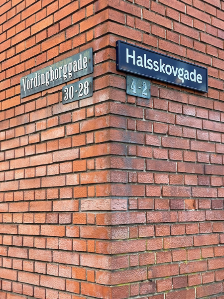Copenhagen, old and new. An example of KBH Sans, the typeface Playtype created for the city of Copenhagen (right), next to a beautiful old cast iron street sign (left). 