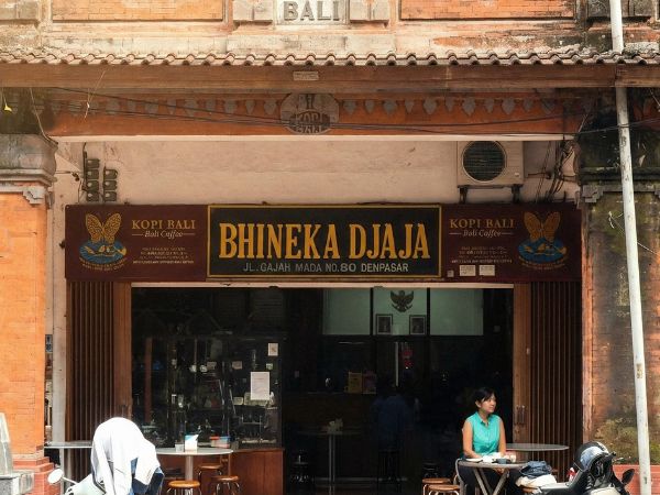 Photo of a cafe Bhineka Djaja, exemplify bold classical signage in Bali. 