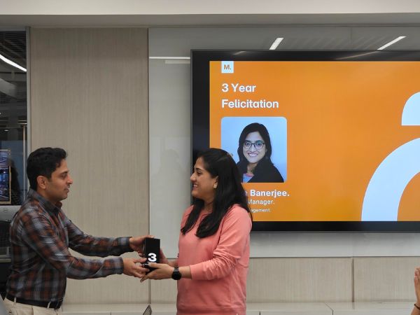 Sneha celebrates 3 years at Monotype with coworkers.