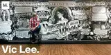 Photo of artist Vic Lee sitting in front of a typographic mural celebrating the life of Virginia Woolf