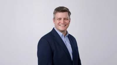Terrance Weinzierl headshot with a grey background