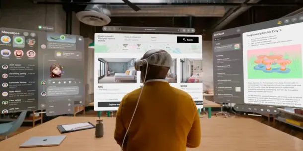 Male with back turned to camera wearing a VR headset. Male with back turned to camera wearing a VR headset.