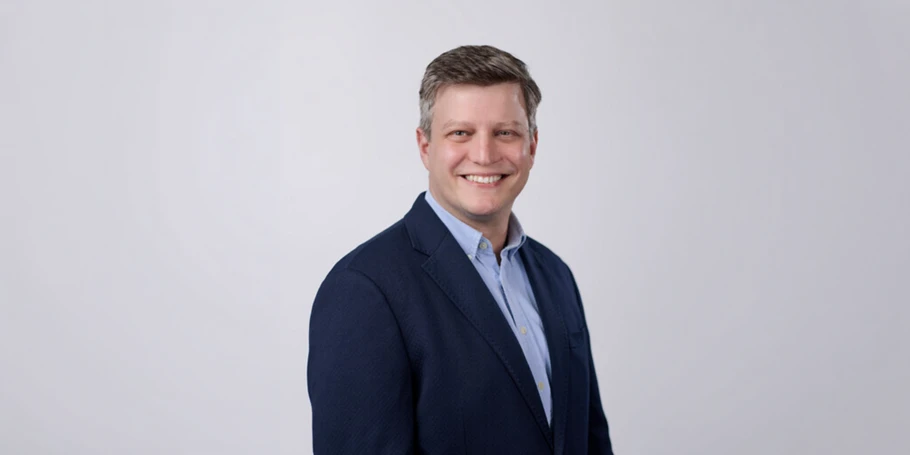 Terrance Weinzierl headshot with a grey background